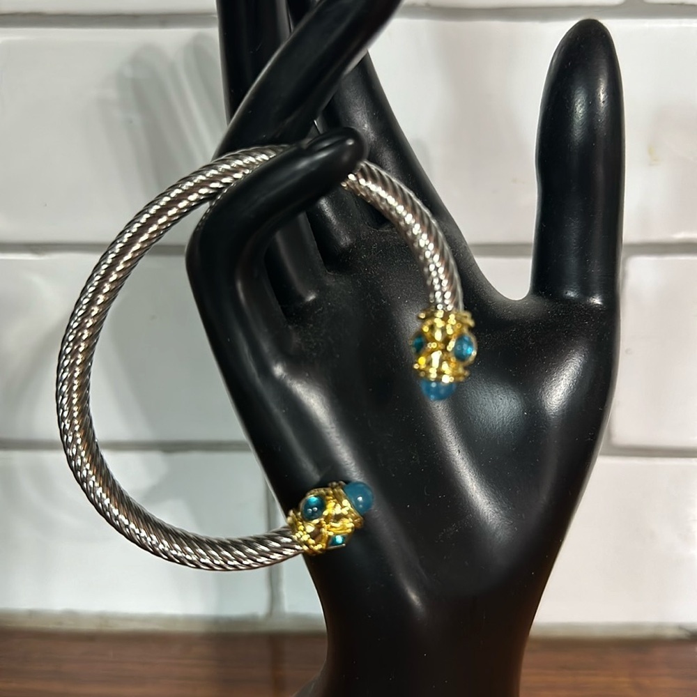 - Sophisticated Silver and Gold Bracelet with Blue Gemstones